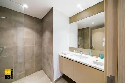 a bathroom with a sink and a mirror at Brand New 2BR in Creek Harbour in Dubai