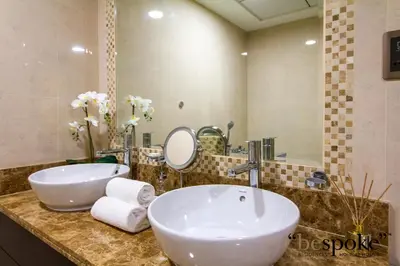 a bathroom with two sinks and a large mirror at Bespoke Holiday Homes - Palm Jumeirah -2 Bedroom Sea View with Beach Access, Balqis in Dubai