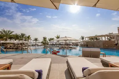 a view of the pool at the resort at Bespoke Holiday Homes - Palm Jumeirah -2 Bedroom Sea View with Beach Access, Balqis in Dubai