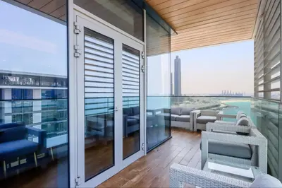 a balcony with a view of a building at Livbnb - Bluewaters 3BR plus Maid's, with Sea Views in Dubai