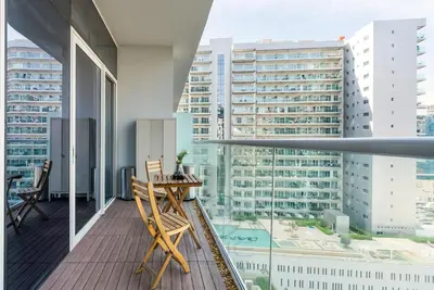 a balcony with a view of a city at Burj View Apartment at Vera, Business Bay in Dubai