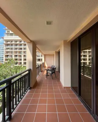 a balcony with chairs and a table on a building at Authentic 2 bdr in Anantara Resort Palm Jumeirah in Dubai