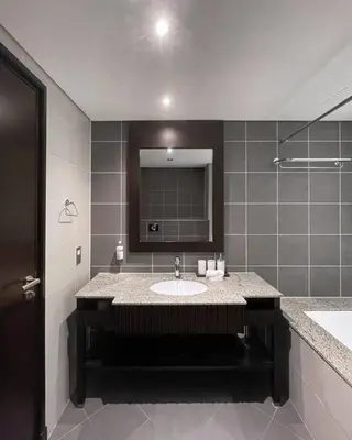 a bathroom with a sink and a mirror at Authentic 2 bdr in Anantara Resort Palm Jumeirah in Dubai