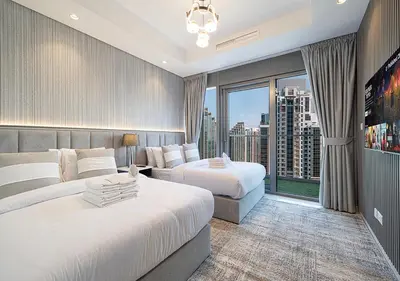 a hotel room with two beds and a large window at Dubai Scenic Infinity Pool with Burj Khalifa Views in Dubai