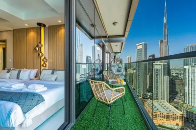 a bedroom with a bed and a balcony with a view at Dubai Scenic Infinity Pool with Burj Khalifa Views in Dubai
