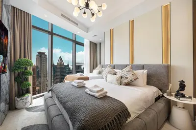 a bedroom with a large bed and a large window at Dubai Scenic Infinity Pool with Burj Khalifa Views in Dubai