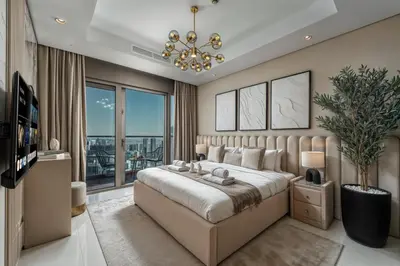 a bedroom with a large bed and a large window at Dubai Scenic Infinity Pool with Burj Khalifa Views in Dubai