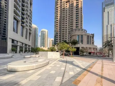 a city street with tall buildings in a city at Spacious and Overlooking Burj & Fountains in Dubai