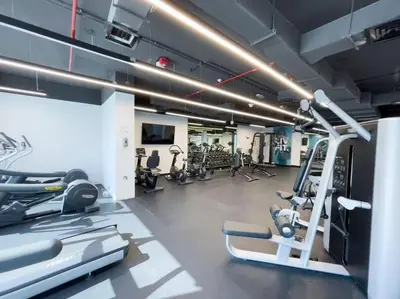 a gym with treadmills and cardio equipment at NEW Listing - Czechin - JBR Beach a Few Steps Away in Dubai