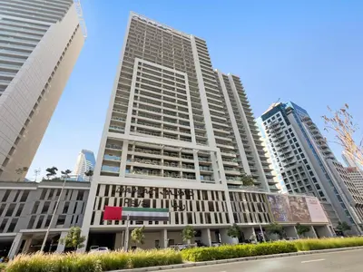 a tall building in a city with tall buildings at Aliving Exclusive 1BR Reva Residence Business Bay-218 in Dubai
