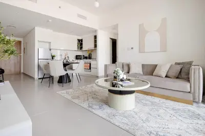 a living room with a couch and a table at Frank Porter - Downtown Views II in Dubai