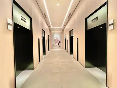 a hallway with black doors in a building at VIDA Residences Dubai Marina 1BR - Seaview, JBR, Dubai Eye in Dubai