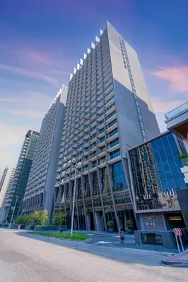 a large building with many windows in a city at Urban Elegance new studio near Dubai Mall & Burj in Dubai