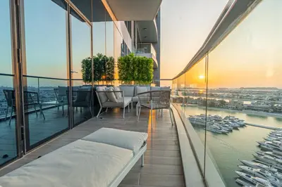 a balcony with a table and chairs on a building at Daniels Sea View 2BR in Oceana The Palm Jumeirah in Dubai
