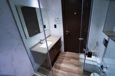 a bathroom with a sink and a shower at Elegant 1bedroom in J ONE in Dubai