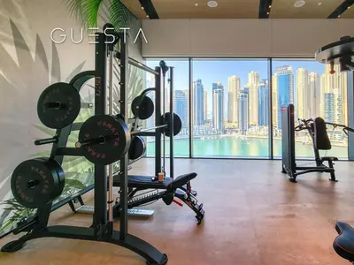 a gym with a view of the city at Vida Residences Dubai Marina by Emaar in Dubai