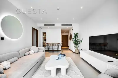 a living room with a couch and a table at Vida Residences Dubai Marina by Emaar in Dubai