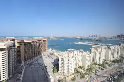 an aerial view of a city with a river and buildings at Livbnb Suites - 1BR w/ Sea View in Palm Tower in Dubai