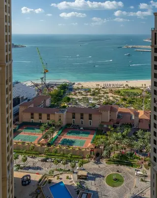 an aerial view of a resort and the ocean at GuestReady - Seaview residence in Dubai Marina in Dubai