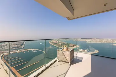 an open balcony with a view of the water at Emaar Beachfront Beach Vista 3bdr apartment in Dubai