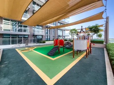 a playground in the middle of a building at Phenomenal 2BD with the beach in Dubai