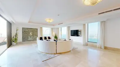 a living room with a white couch and large windows at Huge Penthouse with yacht included and private pool!!! in Dubai