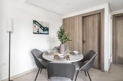 a dining room with a table and chairs at Guestready - Grey Pearl with Big Balcony in Dubai