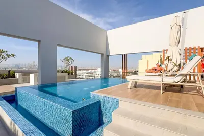 a swimming pool on the roof of a building at Guestready - Grey Pearl with Big Balcony in Dubai