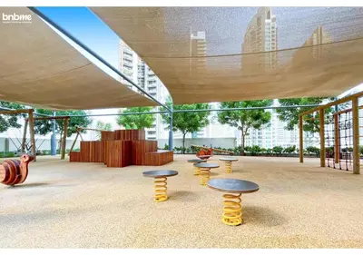 a group of stools under a canopy in a building at bnbme - Chic 1BR Apt w Balcony Pool Gym Access Steps to Burj Khalifa & Dubai Mall in Dubai