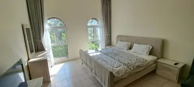 a bedroom with a bed and two windows at DRUVYA HOLIDAY HOMES, Bld DG083, Street No,3 Discovery Gardens, Close to The Gardens Metro 6 minutes walkable in Dubai