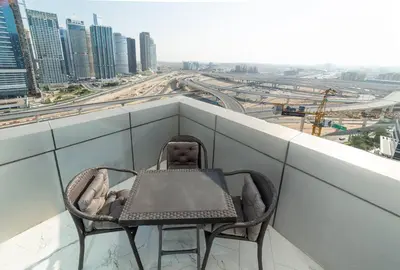 a table and chairs sitting on top of a building at Luxury 2 Bedroom Apartment in Dubai Marina & JBR Beach in Dubai