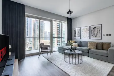 a living room with a couch and a table at GuestReady - Exquisite residence in Dubai Marina in Dubai