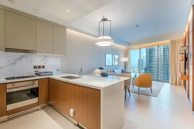 a kitchen with a sink and a counter top at Stunning Full Burj Khalifa View - The Address 2BR Luxury in Dubai