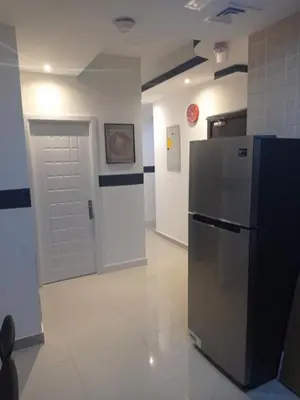 a room with a refrigerator and a white door at Fashion Partition Room Near Mall of The Emirates in Dubai
