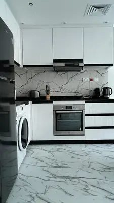a kitchen with a stove and a microwave at Stay in heart of Dubai Marina Residence B walk to the JBR in Dubai
