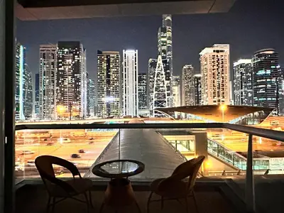 a view of a city at night from a balcony at Stay in heart of Dubai Marina Residence B walk to the JBR in Dubai