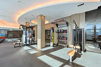 a gym with cardio equipment in a building at Difc 1 Bd apartment in Park Tower in Dubai