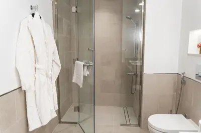 a bathroom with a glass shower with a toilet at New 2 bedroom entire apartment in Madinat Jumeirah Living in Dubai