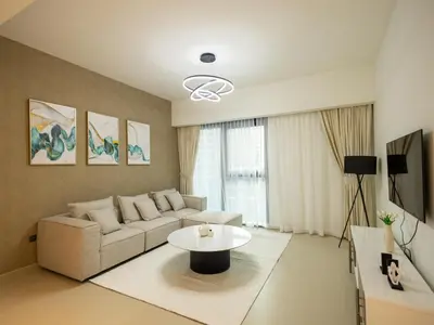 a living room with a couch and a table at MH - Act One Act Two - 2BHK - REF503 in Dubai