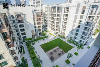 an aerial view of a courtyard in the middle of buildings at Mira Holiday Homes - Fully furnished 1 bedroom in Creek Harbour in Dubai