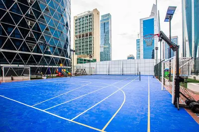 a tennis court in the middle of a city at Bright studio in DIFC near the metro station in Dubai