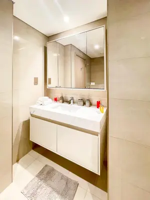 a bathroom with a white sink and a mirror at Beautiful apartment by Dubai Mall 161BR-2 in Dubai