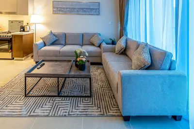 a living room with two couches and a coffee table at 2-Bedroom in the Heart of Downtown Dubai in Dubai