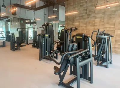 a gym with rows of exercise bikes and treadmills at Amazing One Bedroom Apartment in Downtown Dubai 167FO2-1 in Dubai