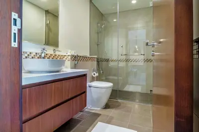 a bathroom with a toilet and a sink and a shower at Luxury Top Floor apt with Full Burj Khalifa view in Dubai
