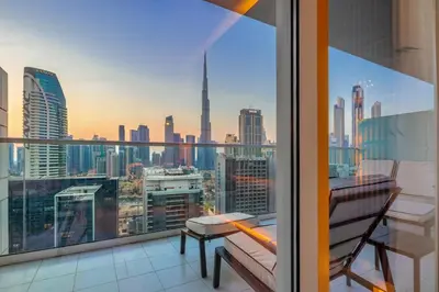 a balcony with a view of a city skyline at Luxury Top Floor apt with Full Burj Khalifa view in Dubai