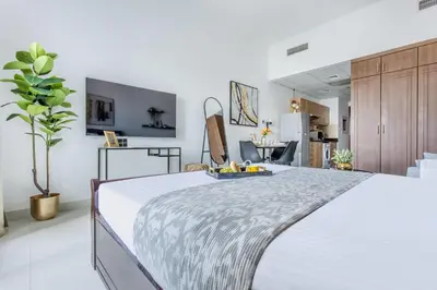 a bedroom with a large bed in a room at Frank Porter - Elite 5 Sports Residence in Dubai