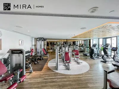 a gym with treadmills and cardio equipment in a building at Mira Holiday Homes - Furnished 1 bedroom in Paramount Tower B in Dubai