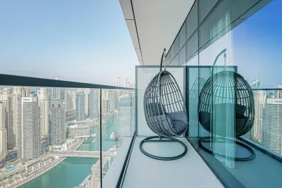 two chairs sitting on the ledge of a building at NEW Luxe 3BR in Vida Marina w/ Breathtaking Views in Dubai