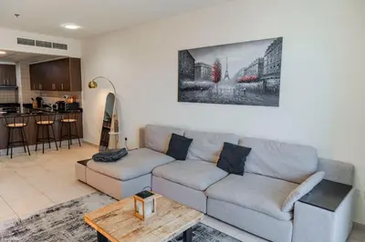 a living room with a couch and a table at Stunning 1 BR Apartment in Dubai Marina in Dubai